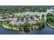 Picturesque aerial view of condos on the lake, featuring well-maintained grounds and convenient parking at 200 Maitland Ave # 153, Altamonte Springs, FL 32701