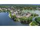 Stunning aerial shot of lakeside condos, highlighting beautiful landscaping, water views, and parking at 200 Maitland Ave # 153, Altamonte Springs, FL 32701