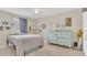 Bright bedroom with plenty of natural light and a lovely soft blue dresser with nine drawers at 200 Maitland Ave # 153, Altamonte Springs, FL 32701