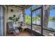 Relaxing screened-in patio with comfortable seating, perfect for enjoying the serene waterfront views at 200 Maitland Ave # 153, Altamonte Springs, FL 32701