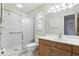 Bathroom features a glass-enclosed shower and a vanity with a sink, offering a clean and functional space at 2024 Linden Road, Winter Park, FL 32792
