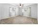 Bright bedroom with two windows and a ceiling fan, creating a comfortable retreat at 2024 Linden Road, Winter Park, FL 32792