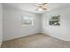 Bedroom featuring neutral walls, ceiling fan, and carpet at 2024 Linden Road, Winter Park, FL 32792