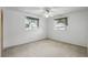 Bright bedroom featuring neutral walls, ceiling fan, and carpet at 2024 Linden Road, Winter Park, FL 32792