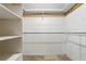 Walk-in closet offering ample storage space with built-in shelves and hanging rods at 2024 Linden Road, Winter Park, FL 32792