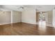 Spacious living area with wood floors, tile transition, neutral color scheme, and an opening to a screened patio at 2024 Linden Road, Winter Park, FL 32792