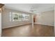 Bright living room featuring hardwood floors, large windows, and neutral paint, creating a welcoming atmosphere at 2024 Linden Road, Winter Park, FL 32792