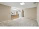 Open-concept living room with carpet flooring and natural light, adjacent to the kitchen at 2024 Linden Road, Winter Park, FL 32792