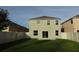 Exterior home view from the spacious backyard, enhanced by a privacy fence, and potential for outdoor living at 2737 Monticello Way, Kissimmee, FL 34741