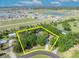 Aerial view displaying home's lot lines nestled amid lush greenery, offering tranquil privacy at 2810 Windsong Ln, St Cloud, FL 34772