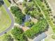 Overhead shot of home with dense foliage, offering privacy and a natural aesthetic at 2810 Windsong Ln, St Cloud, FL 34772