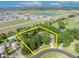 Aerial view shows lot lines in a community near bodies of water at 2810 Windsong Ln, St Cloud, FL 34772