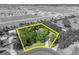 Aerial view shows lot lines of a property set within a leafy residential area at 2810 Windsong Ln, St Cloud, FL 34772