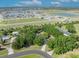 A serene aerial view of a Primary-planned community, featuring lush landscaping and a tranquil lake at 2810 Windsong Ln, St Cloud, FL 34772