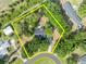 Aerial view of property showcasing the home's placement and surrounded by mature trees at 2810 Windsong Ln, St Cloud, FL 34772