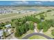 A serene aerial view of a Primary-planned community, featuring lush landscaping and a tranquil lake at 2810 Windsong Ln, St Cloud, FL 34772