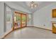 Dining area with lots of natural light, tile floors, and glass patio doors at 2810 Windsong Ln, St Cloud, FL 34772