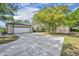 Lovely one-story home featuring a spacious driveway and a two-car garage at 2810 Windsong Ln, St Cloud, FL 34772