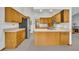 Kitchen with tile floors, wood cabinets, and stainless-steel refrigerator at 2810 Windsong Ln, St Cloud, FL 34772