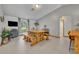Bright dining area that flows to a TV room space, perfect for enjoying time with friends and Gathering at 2810 Windsong Ln, St Cloud, FL 34772