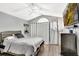 This bedroom features a decorative window, laminate floors, and closet with curtain instead of door at 2848 Wilshire Rd, Clermont, FL 34714
