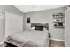 This bedroom features a laminate floor, built-in shelves, and a double door closet at 2848 Wilshire Rd, Clermont, FL 34714