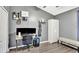 This gray bedroom features laminate wood floors, a desk with computer and seating bench at 2848 Wilshire Rd, Clermont, FL 34714