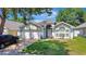 Inviting single-Gathering home featuring a well-kept lawn, two-car garage, and classic architecture at 2848 Wilshire Rd, Clermont, FL 34714