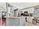 Clean kitchen space with white cabinets, stainless steel appliances, and a breakfast bar at 2848 Wilshire Rd, Clermont, FL 34714