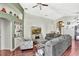Bright and airy living area with comfortable seating, built-in shelving, and wood floors at 2848 Wilshire Rd, Clermont, FL 34714