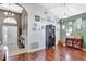 Elegant entryway featuring high ceilings, wood floors, and stylish decor at 2848 Wilshire Rd, Clermont, FL 34714