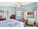 A main bedroom shows an open doorway that leads to the kitchen and a wall mounted TV at 2848 Wilshire Rd, Clermont, FL 34714