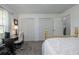 Cozy bedroom features a neutral palette, large windows, and a dedicated workspace at 3306 Fishermans Cv, Winter Park, FL 32792