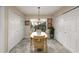 Inviting dining area with a chandelier, natural light, and closet space at 3306 Fishermans Cv, Winter Park, FL 32792