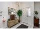 Bright entryway with tiled floors, decorative accents, and a welcoming white door at 3306 Fishermans Cv, Winter Park, FL 32792