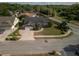 Bird's-eye view of a well-maintained home with a brick facade, an attached garage, and green lawn at 3306 Fishermans Cv, Winter Park, FL 32792
