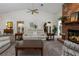 Inviting living room featuring a brick fireplace, comfortable seating, and ample natural light at 3306 Fishermans Cv, Winter Park, FL 32792