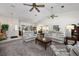 Spacious living room with plush sofas, ceiling fans, and a welcoming atmosphere at 3306 Fishermans Cv, Winter Park, FL 32792