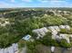 A bird's eye view of townhome community with pool surrounded by lush greenery at 35 Misners Trl, Ormond Beach, FL 32174