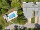 Aerial view of community pool and townhomes showcasing well-maintained landscaping and neighborhood streets at 35 Misners Trl, Ormond Beach, FL 32174