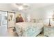 Charming bedroom with floral bedding, a barn door, and stylish decor, creating a cozy retreat at 35 Misners Trl, Ormond Beach, FL 32174