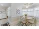 Charming dining area with light-filled windows and a round table at 35 Misners Trl, Ormond Beach, FL 32174