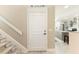 Entryway with door leading into kitchen, and staircase to the second level at 35 Misners Trl, Ormond Beach, FL 32174