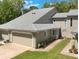 Charming two-story townhouse featuring a two-car garage and well-maintained lawn and landscape at 35 Misners Trl, Ormond Beach, FL 32174