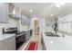 Updated kitchen featuring stainless steel appliances and light gray cabinetry at 35 Misners Trl, Ormond Beach, FL 32174