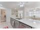 Modern kitchen features stone countertops, stainless appliances, and breakfast bar at 35 Misners Trl, Ormond Beach, FL 32174