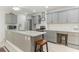 Modern kitchen featuring grey cabinetry, stainless steel appliances, and expansive countertop seating at 35 Misners Trl, Ormond Beach, FL 32174