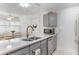 Kitchen island features stainless steel appliances and gray cabinetry at 35 Misners Trl, Ormond Beach, FL 32174