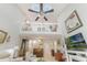 Bright living room features high ceilings, skylights, a loft area, and a piano at 35 Misners Trl, Ormond Beach, FL 32174