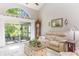 Bright living room boasting high ceilings, neutral colors, and sliding glass doors at 35 Misners Trl, Ormond Beach, FL 32174